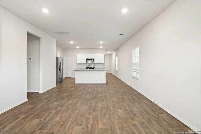 a view of kitchen with wooden floor