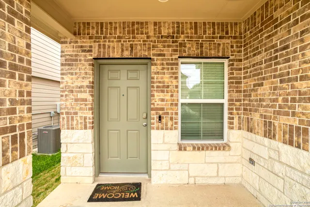 a view of a door and a window