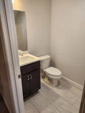 a bathroom with a toilet and a sink