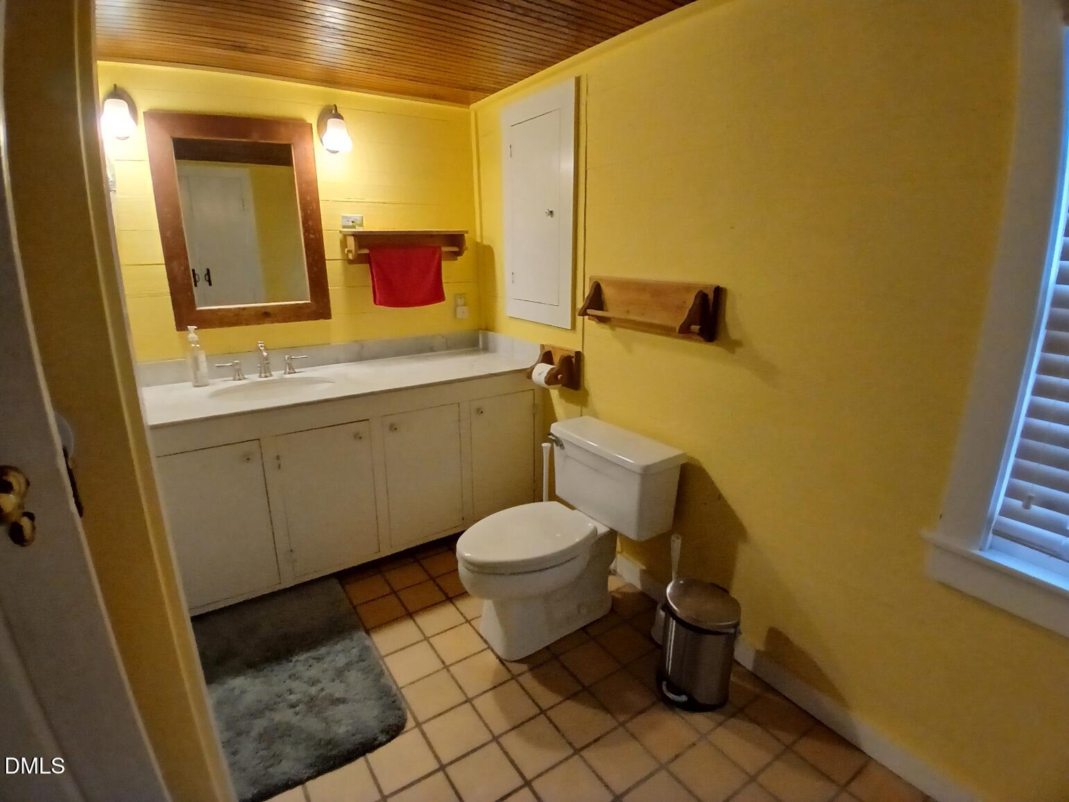 1920 Kelly Road Apex, NC 27502 - Photo 16 of 44 a bathroom with a toilet sink and mirror