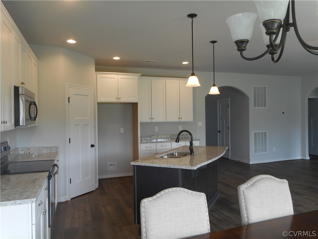 4032 Rotherham Circle Prince George, VA 23875 - Photo 6 of 10 Showing white cabinets, corner pantry, stainless a