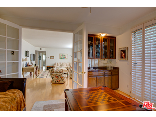 241 South Reeves Drive, Unit 302 Beverly Hills, CA 90212 - Photo 6 of 10 a living room with furniture and large window