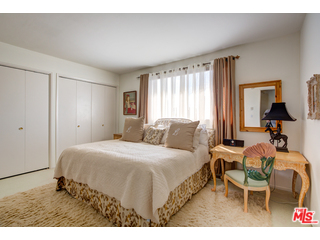241 South Reeves Drive, Unit 302 Beverly Hills, CA 90212 - Photo 9 of 10 a bedroom with a bed and window