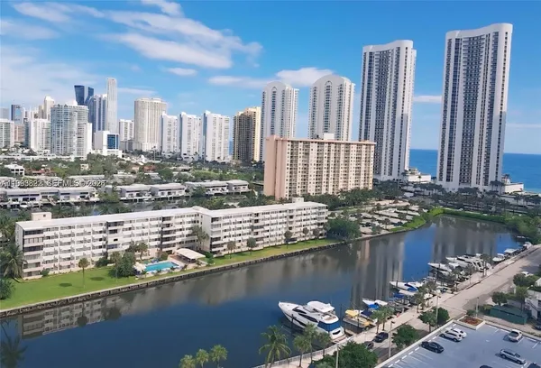 a view of a swimming pool with a yard