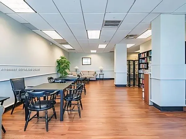 a view of a hall way with furniture