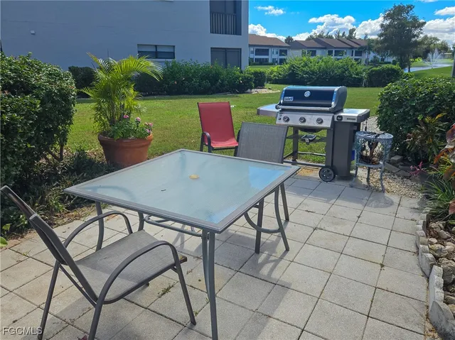 a view of a backyard with sitting area
