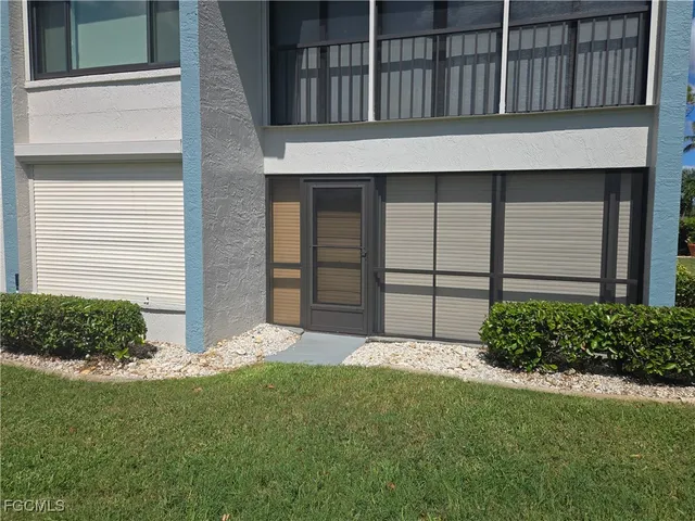 a view of a backyard of the house