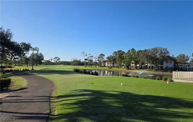 a view of a golf course with a lake