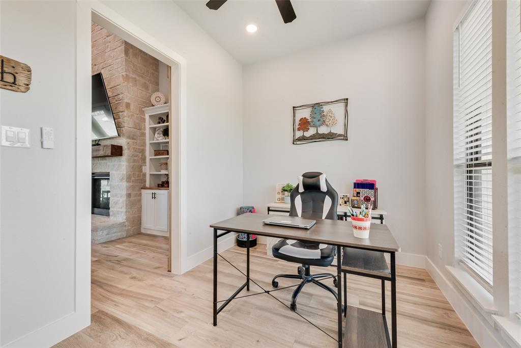 12880 Pruett Road Krum, TX 76249 - Photo 11 of 27 a view of a workspace with furniture and a window