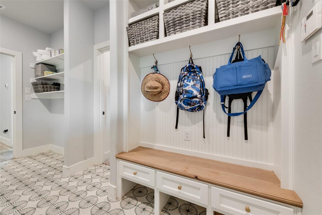 12880 Pruett Road Krum, TX 76249 - Photo 16 of 27 a view of a hallway with washer and dryer