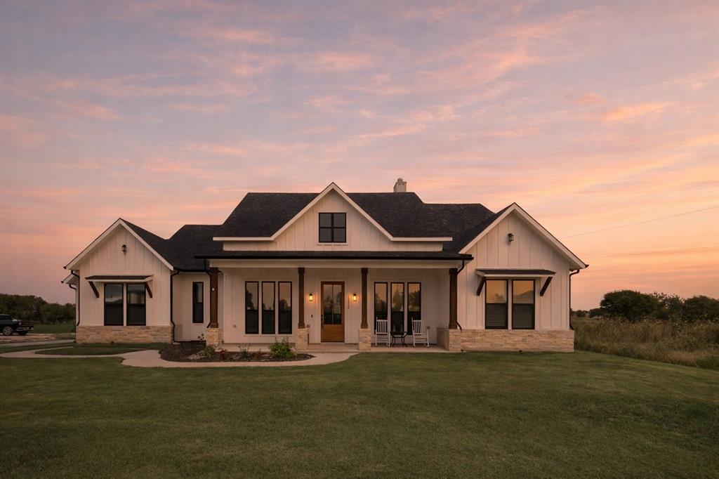 12880 Pruett Road Krum, TX 76249 - Photo 6 of 27 a front view of a house with a garden and porch