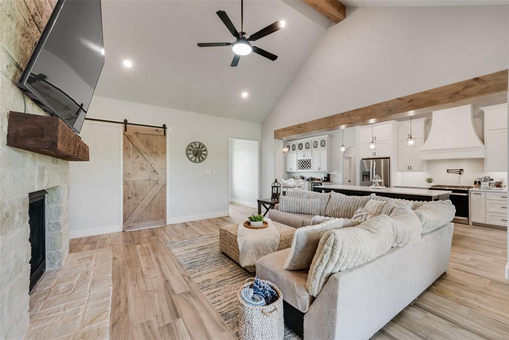 12880 Pruett Road Krum, TX 76249 - Photo 10 of 27 a living room with furniture and a flat screen tv