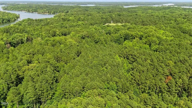 a view of a field with an ocean view