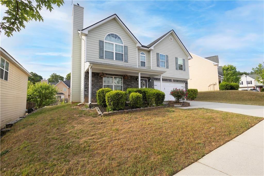 2787 Riders Court Northeast Dacula, GA 30019 - Photo 2 of 26 a view of a house with a patio