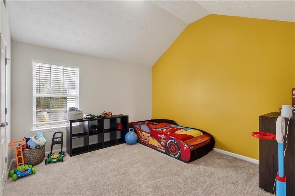 2787 Riders Court Northeast Dacula, GA 30019 - Photo 21 of 26 a room with toys and a table
