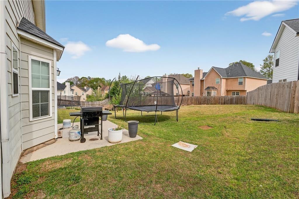 2787 Riders Court Northeast Dacula, GA 30019 - Photo 24 of 26 a view of a house with a outdoor space
