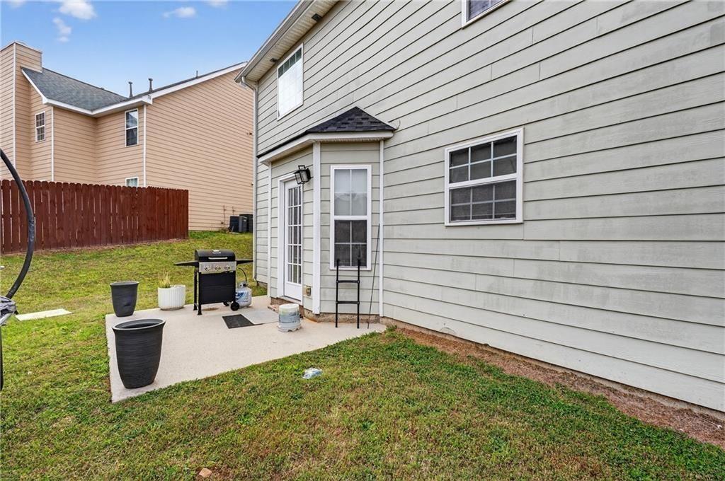 2787 Riders Court Northeast Dacula, GA 30019 - Photo 26 of 26 a view of a patio with chairs