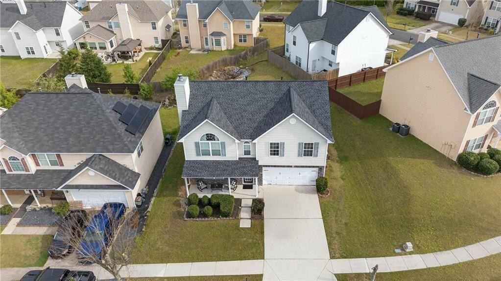 2787 Riders Court Northeast Dacula, GA 30019 - Photo 4 of 26 a aerial view of a house with a yard