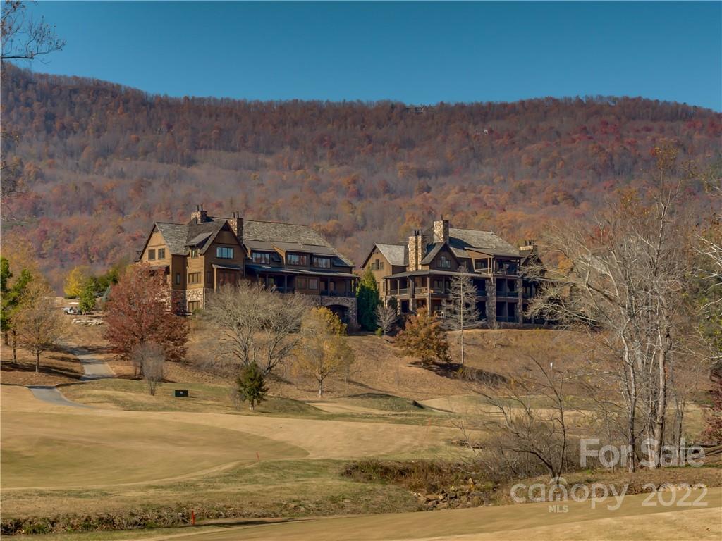 Lot 163 Deep Gap Farm Road East Mill Spring, NC 28756 - Photo 12 of 15 a view of a town with mountains in the background