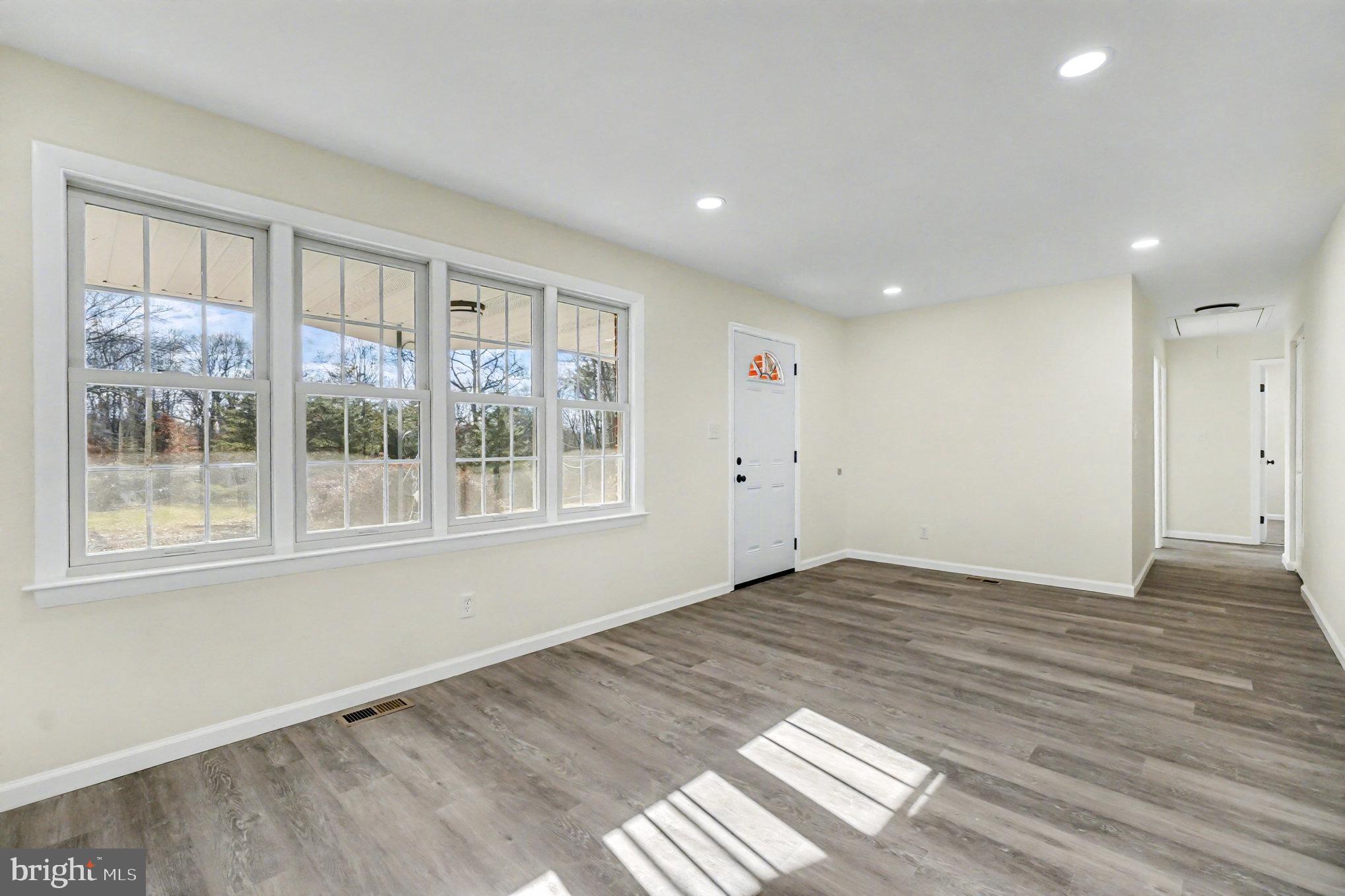 661 Pilot Town Road Conowingo, MD 21918 - Photo 11 of 38 a view of empty room with wooden floor and fan
