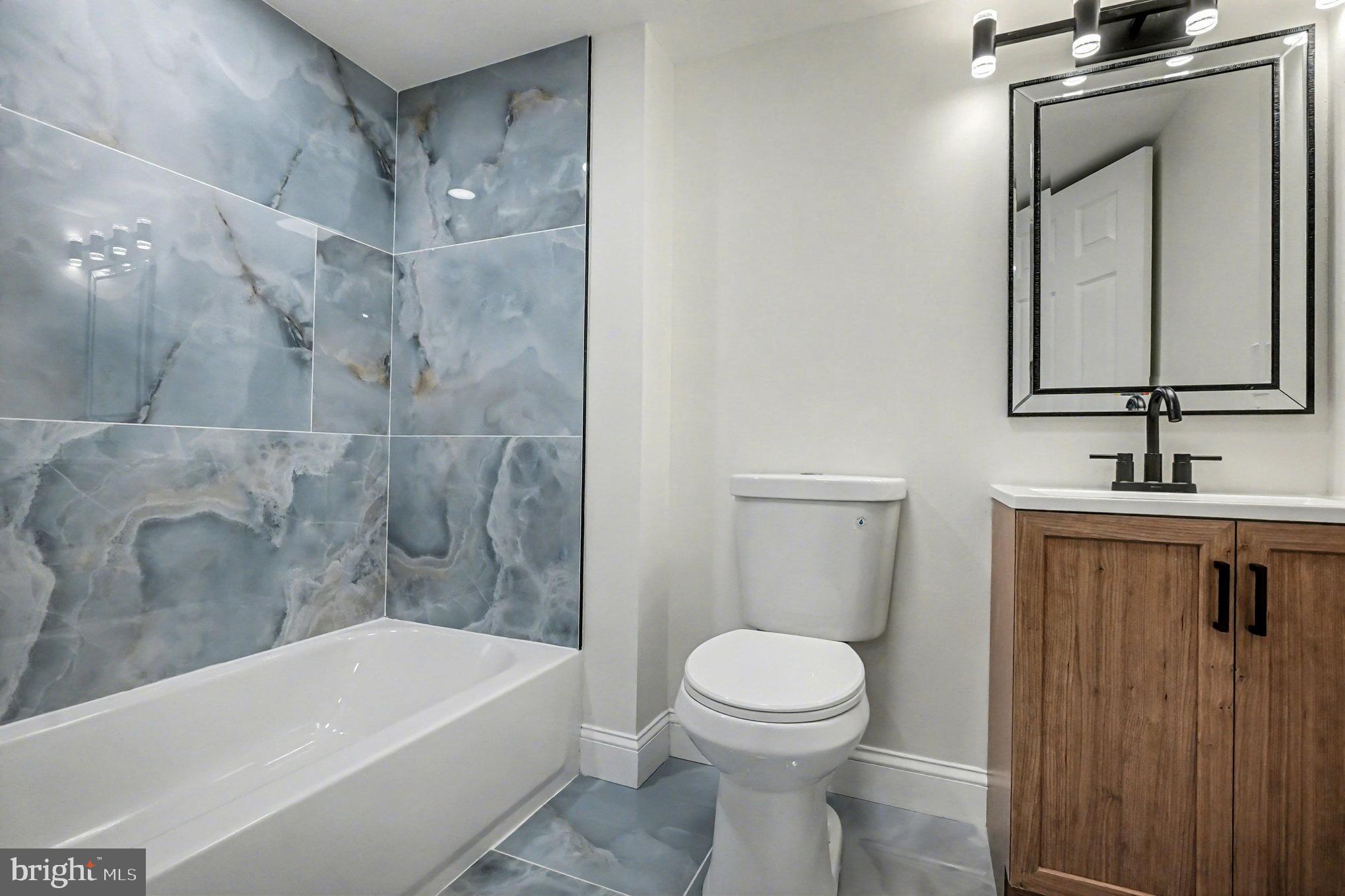 661 Pilot Town Road Conowingo, MD 21918 - Photo 12 of 38 a bathroom with a toilet a sink and bathtub