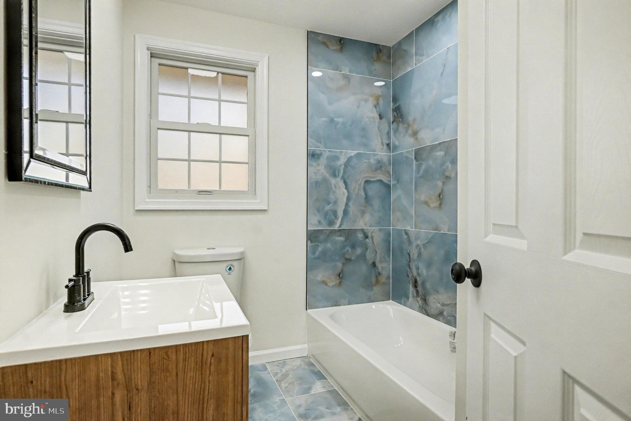 661 Pilot Town Road Conowingo, MD 21918 - Photo 15 of 38 a bathroom with a sink and mirror