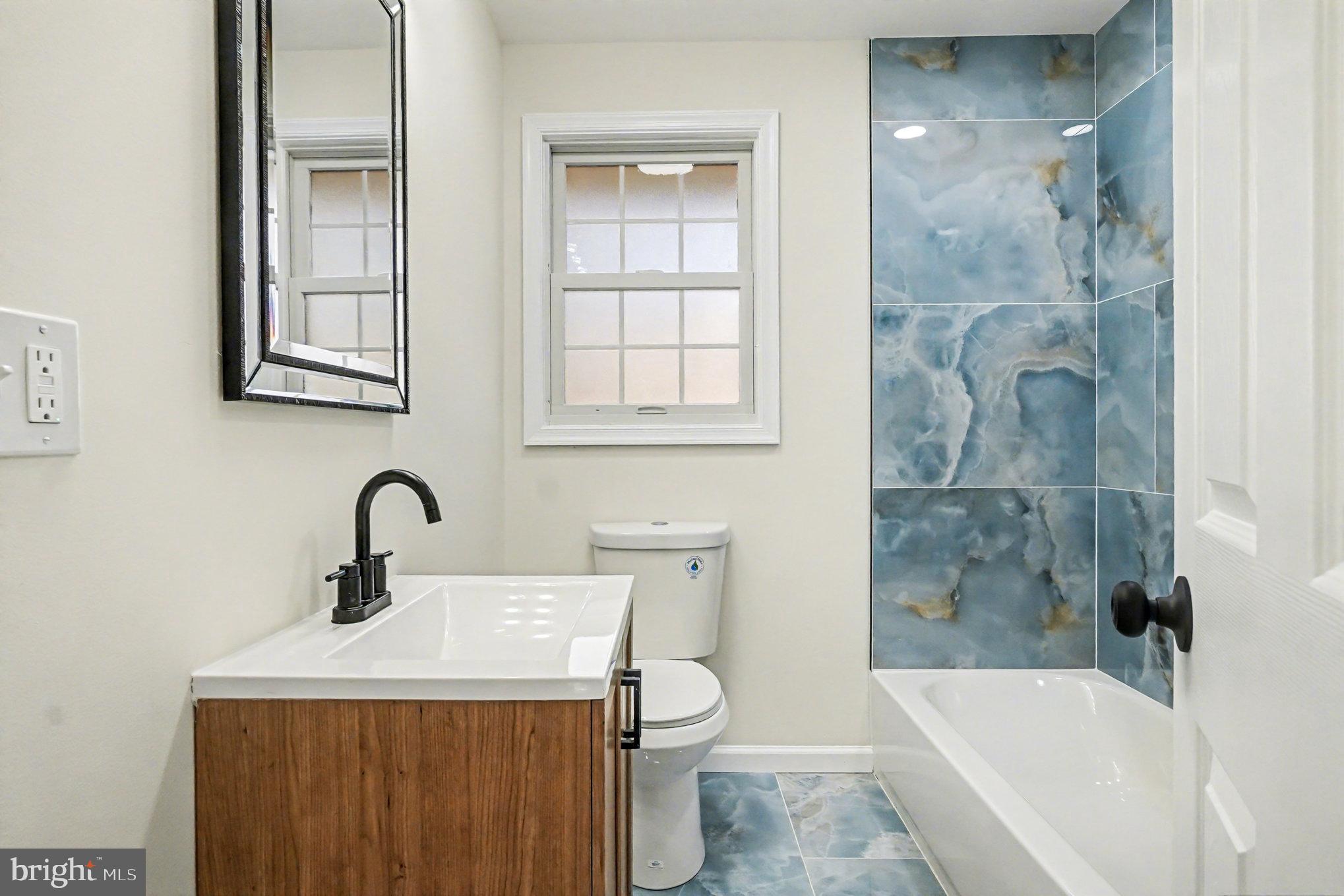 661 Pilot Town Road Conowingo, MD 21918 - Photo 16 of 38 a bathroom with a sink a toilet and bathtub