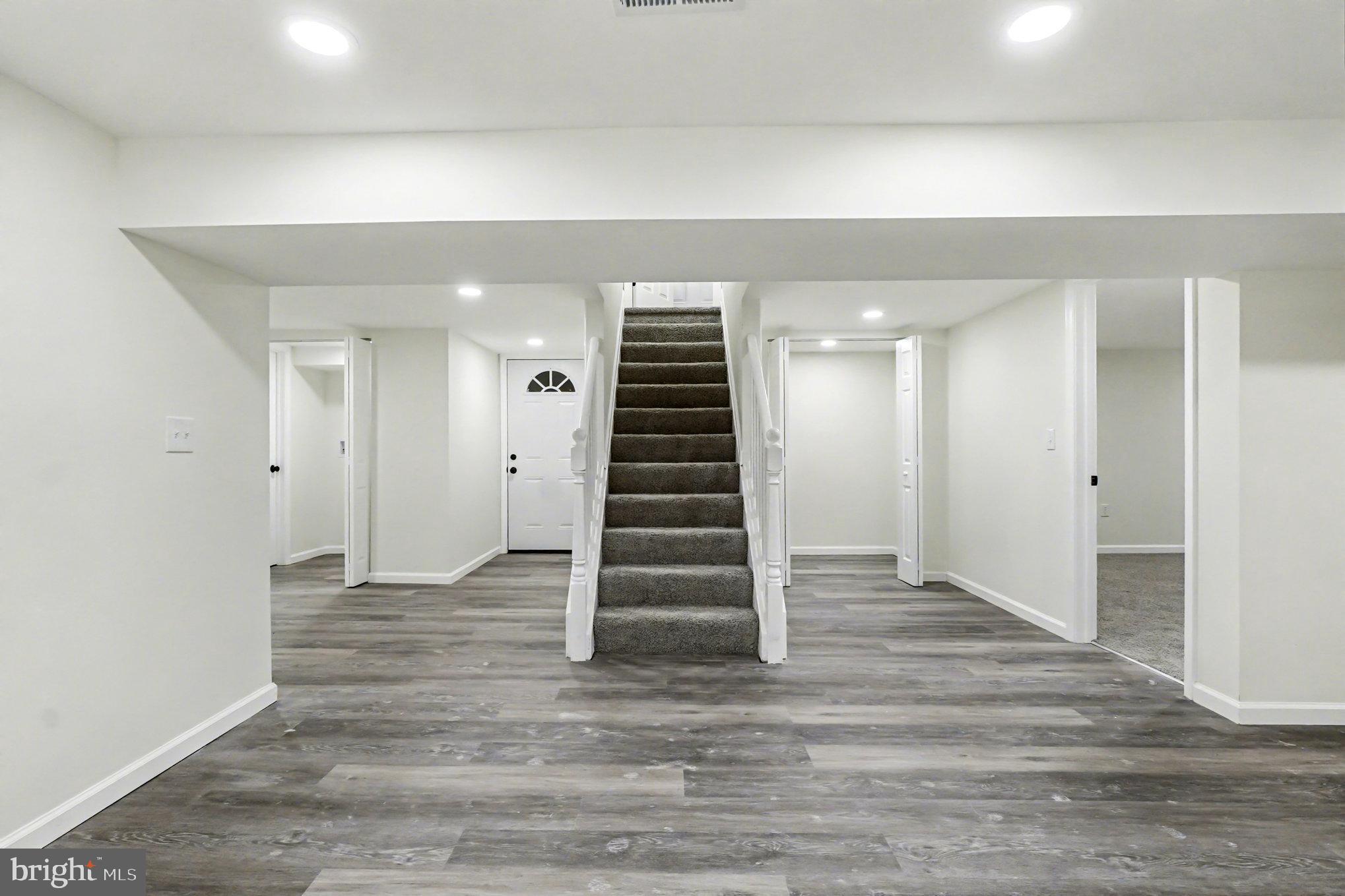 661 Pilot Town Road Conowingo, MD 21918 - Photo 25 of 38 wooden floor in an empty room with a stairs