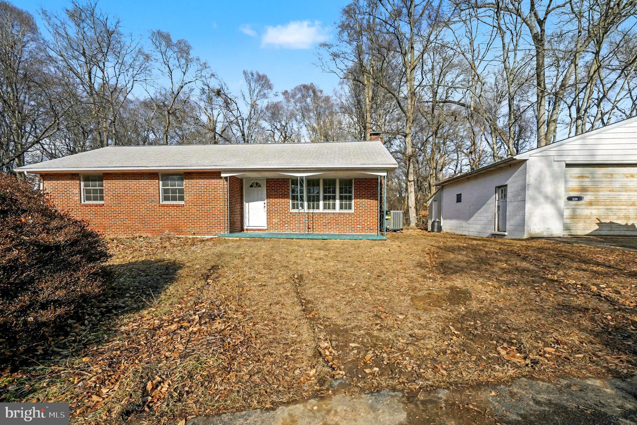 661 Pilot Town Road Conowingo, MD 21918 - Photo 4 of 38 a front view of a house with a yard and garage