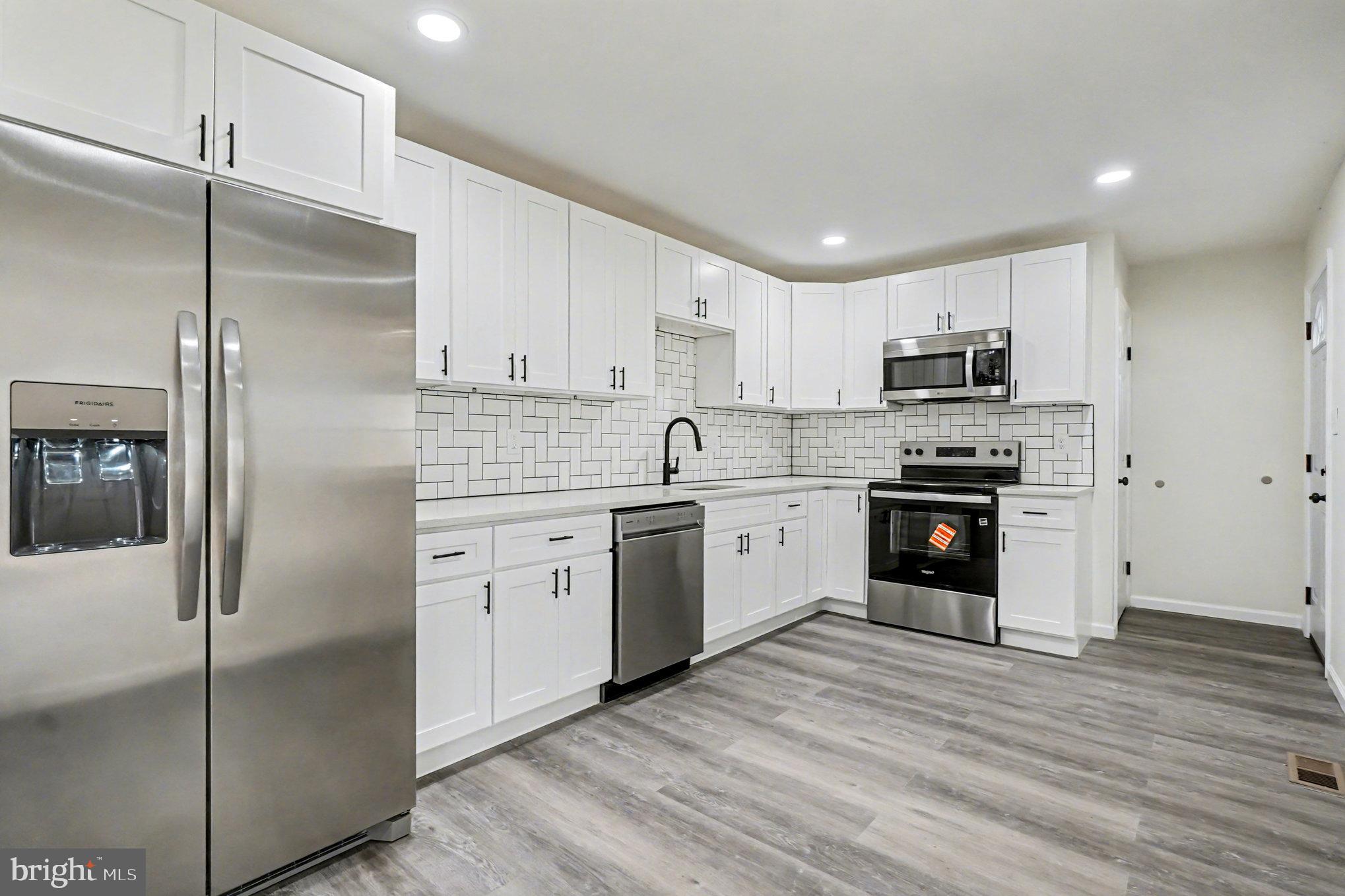 661 Pilot Town Road Conowingo, MD 21918 - Photo 5 of 38 a kitchen with cabinets stainless steel appliances and a counter space