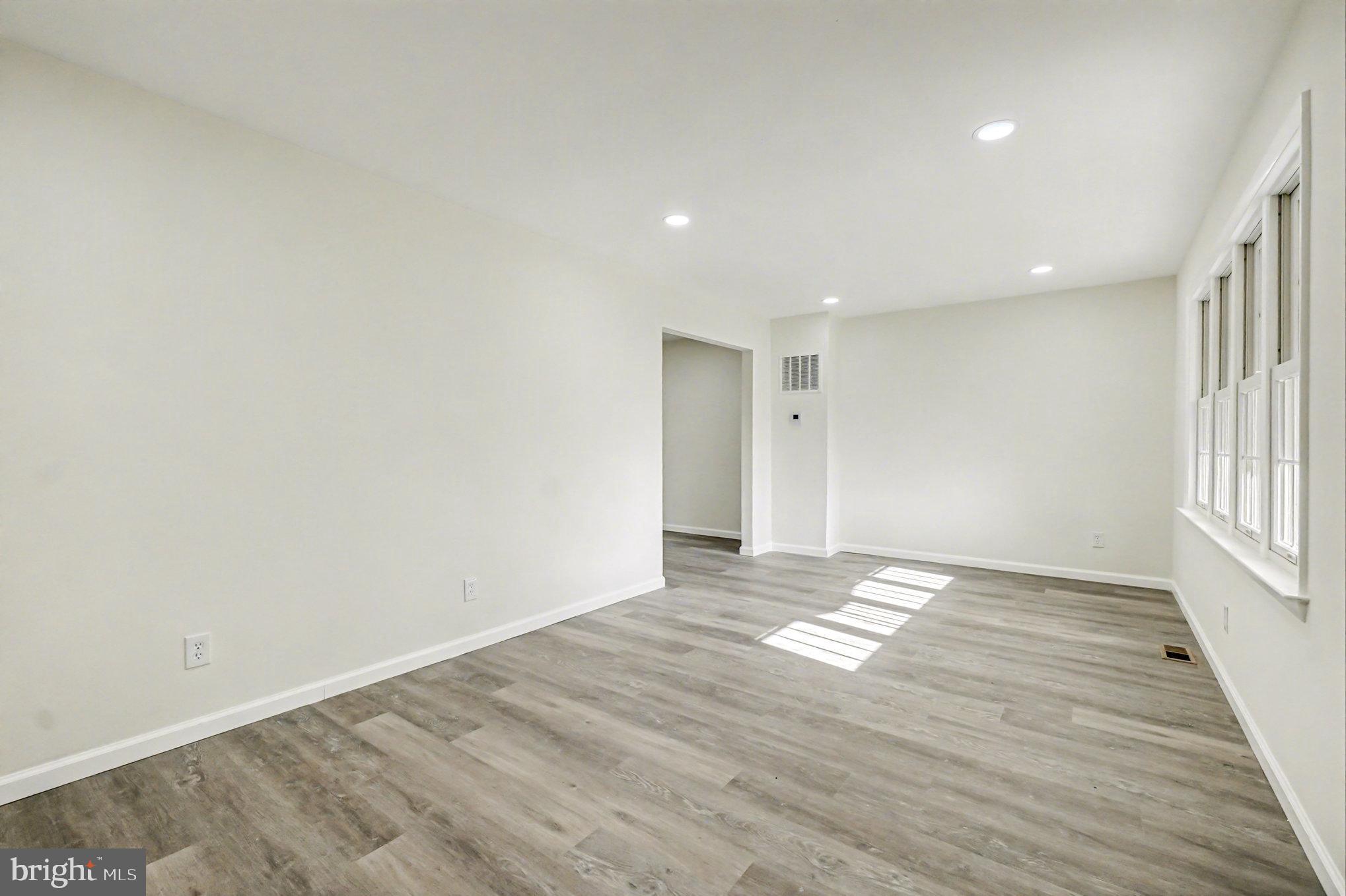 661 Pilot Town Road Conowingo, MD 21918 - Photo 9 of 38 a view of an empty room with wooden floor and a window