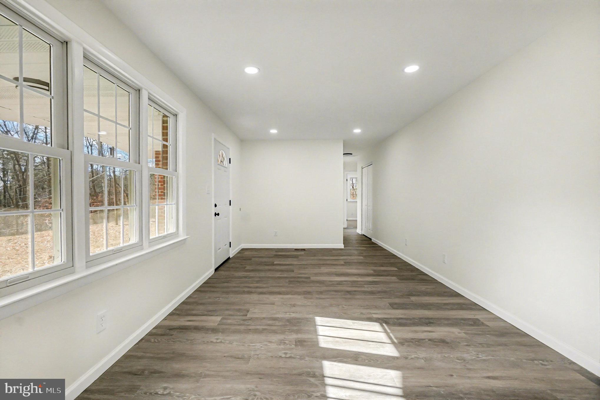 661 Pilot Town Road Conowingo, MD 21918 - Photo 10 of 38 a view of an empty room with wooden floor and a window