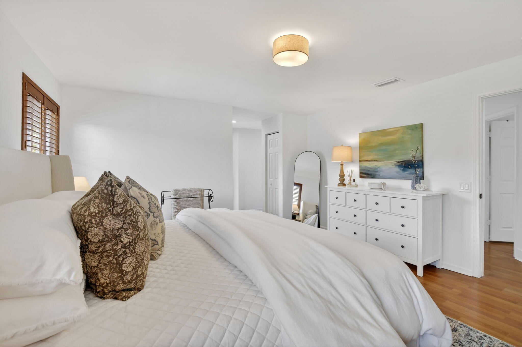 4299 Laurel Ridge Circle Weston, FL 33331 - Photo 50 of 103 a large bedroom with a bed and flat tv screen on dresser