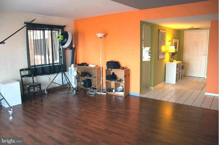 2903 Fallstaff Road, Unit 408 Baltimore, MD 21209 - Photo 7 of 8 a view of an entryway with wooden floor and a livingroom