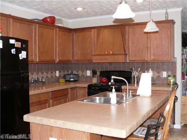 8586 Erect Road Seagrove, NC 27341 - Photo 2 of 14 Kitchen. Wonderful kitchen with lots cabinets, island and tile back splash