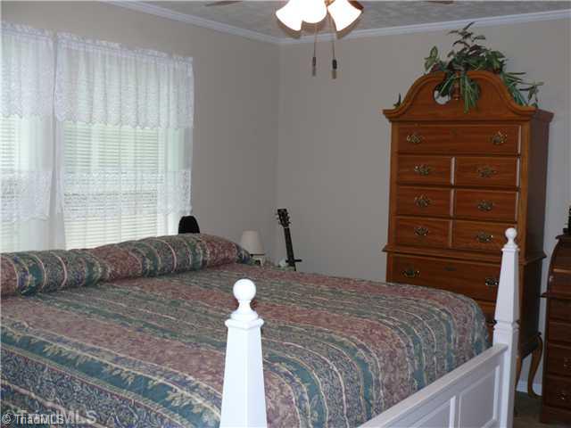 8586 Erect Road Seagrove, NC 27341 - Photo 6 of 14 Master Bedroom. Master bedroom is private opposite the other 2 bedrooms on other side of living room. Has master bath and walk in closet