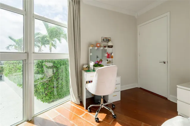 a work room with furniture and a window