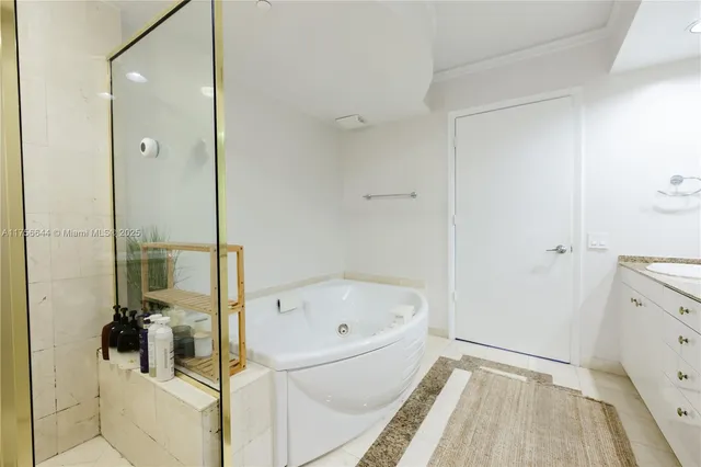a bathroom with a bathtub and a shower