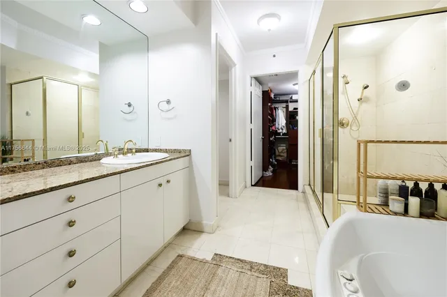 a spacious bathroom with a double vanity sink shower and a mirror