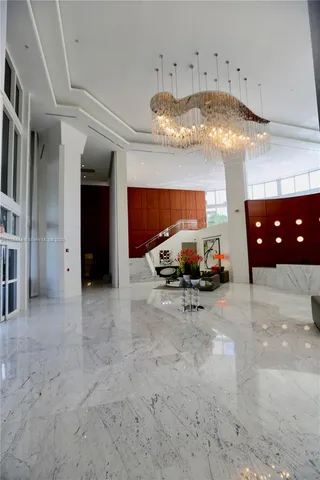 a kitchen with kitchen island a stove and a refrigerator