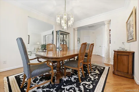 a view of a dining room with furniture and chandelier