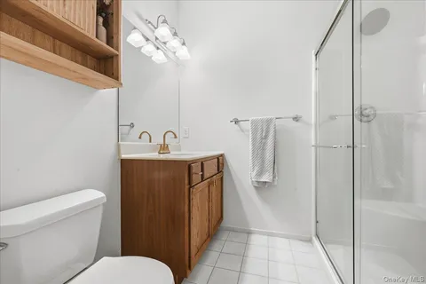 a bathroom with a toilet sink and shower