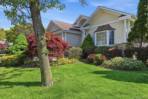 a front view of house with garden