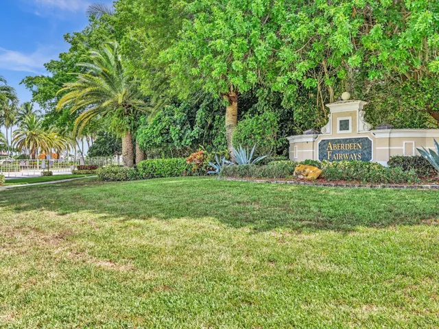a aerial view of a house with yard