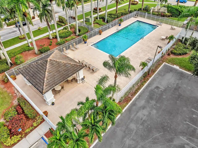 a living room with furniture large window and a chandelier
