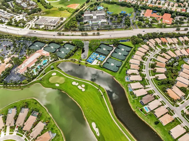 a view of a patio with table and chairs with wooden floor and fence