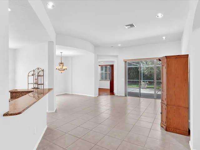 a kitchen with stainless steel appliances a refrigerator and a stove top oven