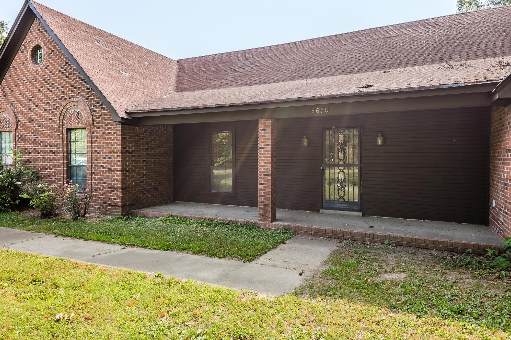 8670 Deadfall Road Millington, TN 38053 - Photo 2 of 25 a front view of a house with a yard
