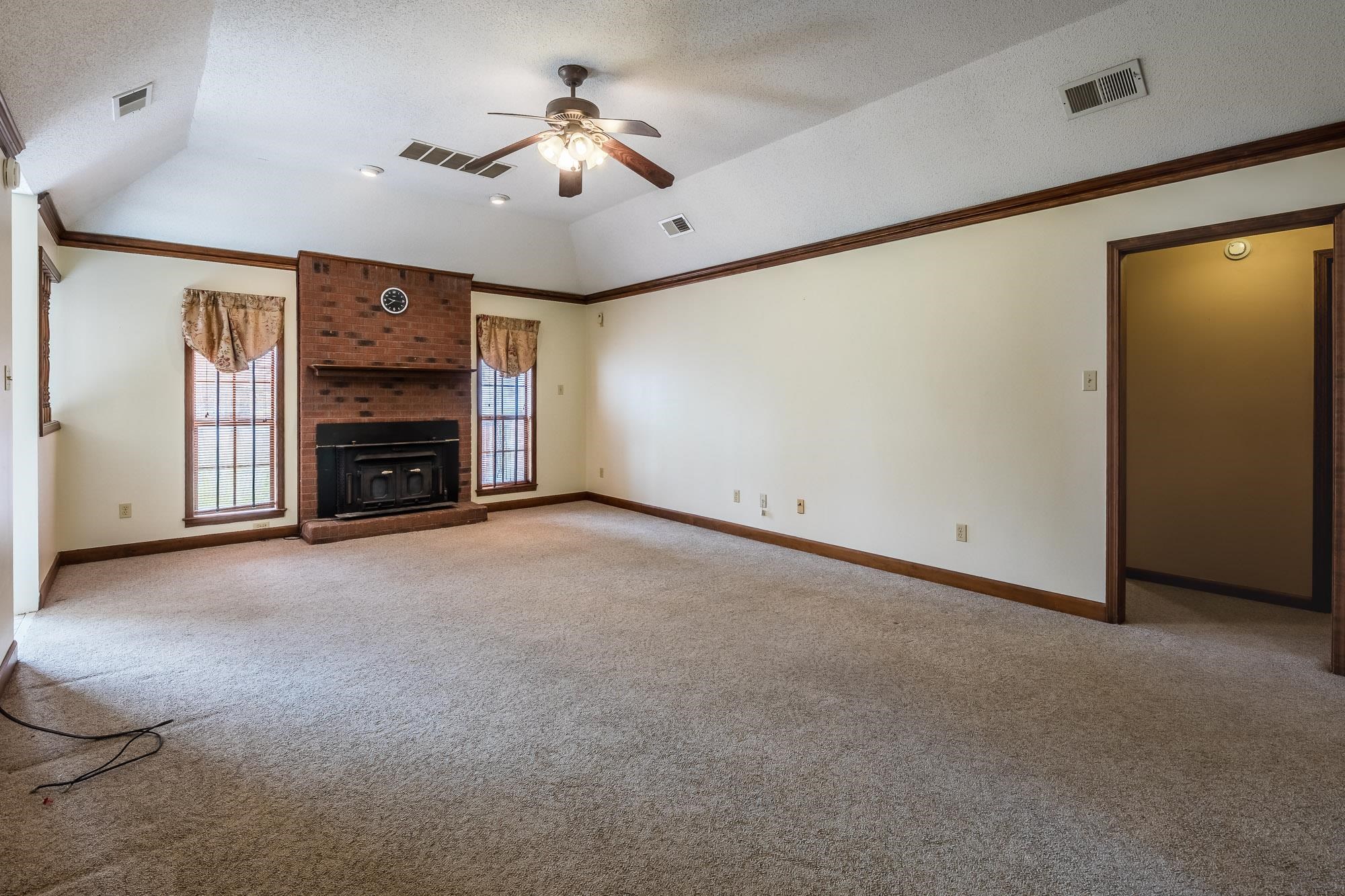 8670 Deadfall Road Millington, TN 38053 - Photo 6 of 25 a view of an empty room with a fireplace