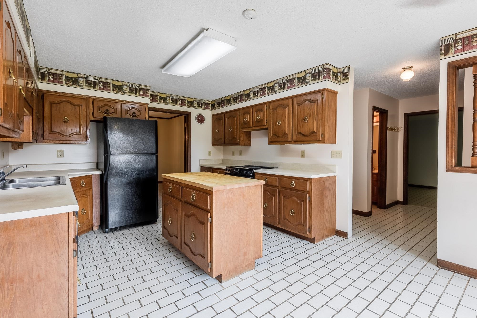 8670 Deadfall Road Millington, TN 38053 - Photo 10 of 25 a kitchen with a refrigerator sink and stove